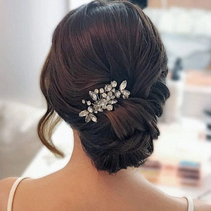 Handmade bridal hair comb with silver leaf design and sparkling rhinestones for weddings