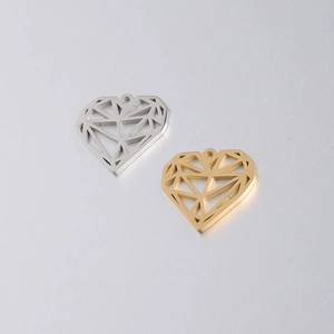 Close-up of hollow geometric heart pendants in gold and silver stainless steel