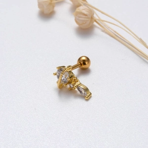 Detail of gold heart and teardrop zircon stud earring with a secure screw back ball