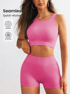 Detail of pink seamless ribbed yoga set showing high elasticity and breathable fabric