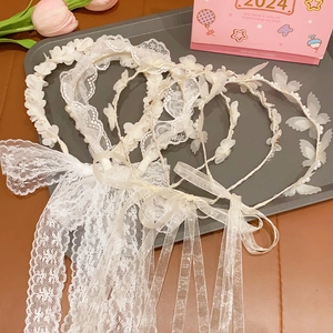 Elegant set of white lace and floral headbands with pearls and long flowing ribbons