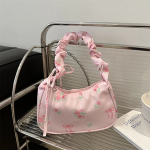 Pink floral canvas underarm bag with sweet rose prints and ruffled drawstring strap