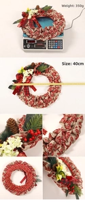 Christmas wreath detail with red berries pine cones and Merry Christmas ribbon on burlap
