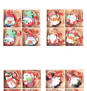 Detail view of wooden Christmas gnomes and snowman ornaments in a partitioned wooden box