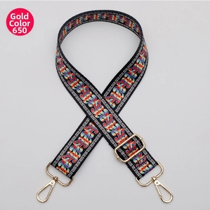 Close-up of retro ethnic style woven shoulder strap with gold metal hooks and buckle