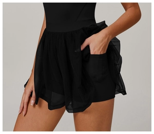 Detail shot of black mesh sports skort with functional side pocket on inner shorts