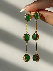 Detail of 18k gold plated drop earrings with vintage green chalcedony and long links