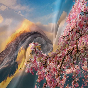 Detailed macro view of the Mount Fuji and cherry blossom print on a bohemian tapestry fabric
