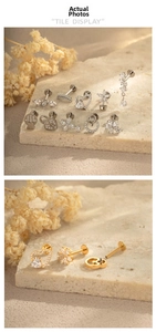 Detailed flat back ear studs set in titanium with zircon heart and cross shapes