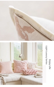Detailed view of pink faux fur and geometric jacquard fabric textures on cushion covers
