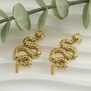 Macro shot of 18K gold plated snake stud earrings with snake scales and zircon stones