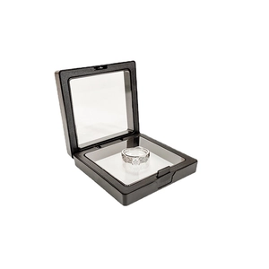 Black square PE film floating jewelry box displaying a silver diamond ring on white