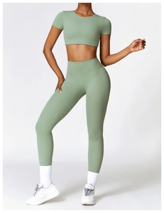 Close-up of high-waisted seamless yoga leggings and cropped top in moss green