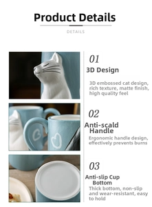 Detail of blue matte ceramic mug with 3D cat relief, ergonomic handle and anti-slip base