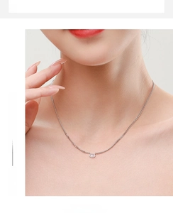 Elegant S925 silver necklace with oval faux diamond pendant worn by a model