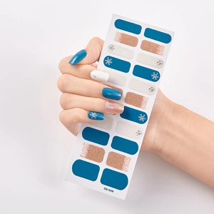 Detail of SS-009 nail stickers with blue, white, and gold glitter snowflake patterns