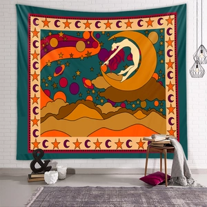 Detail of bohemian tapestry featuring cosmic celestial motifs and artistic feminine silhouette