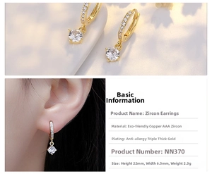Close-up of golden S925 silver hoop earrings with AAA cubic zirconia and heart charms