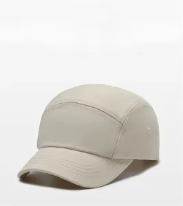Detail view of the breathable cotton fabric and reinforced stitching on the short brim cap