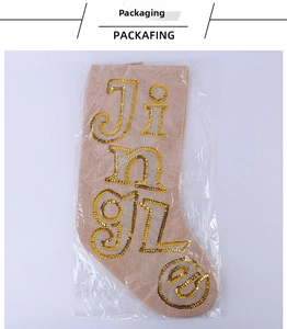 Detail of Christmas stocking with gold sequins Jingle lettering in packaging
