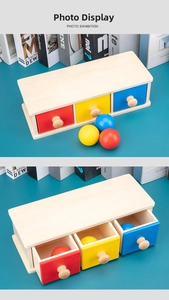 Macro view of Montessori wooden coin box showing three colored drawers and matching balls