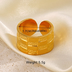 Detail of adjustable 18K gold plated ring featuring geometric texture and dot granulation