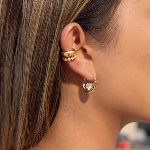 Luxury gold stainless steel earrings set with round zircon stones for elegant women