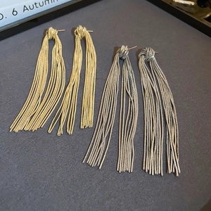 Elegant gold and silver metal knot tassel earrings for women with long fringe chains