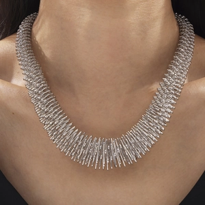 Edgy industrial style silver spring choker necklace in stainless steel finish on model
