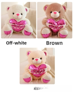 Detail showing plush teddy bears in beige and brown holding pink shiny LOVE hearts
