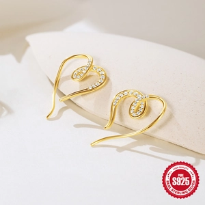 Exaggerated gold S925 sterling silver heart earrings with sparkling crystals on stone base