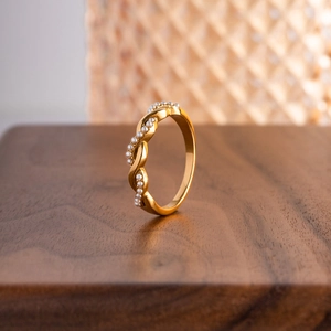Braided twist titanium steel ring with white pearls in elegant 18K gold plating finish