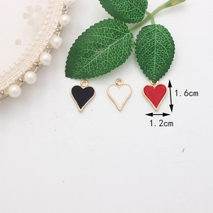 Macro detail of heart-shaped enamel charms in black, white, and red with 1.6x1.2cm size