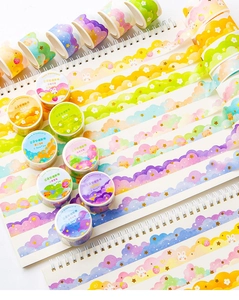 Detailed close-up of dreamy cloud washi tape with scalloped edges and gold foil accents