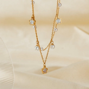 Elegant gold-tone multi-layer stainless steel necklace with pearl and flower pendants