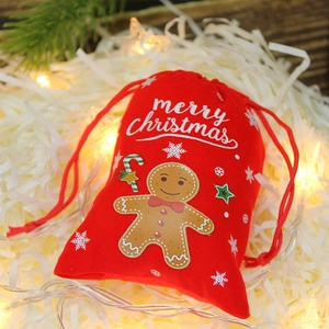 Pochette cadeau de Noël en velours rouge avec bonhomme en pain d'épice et cordon