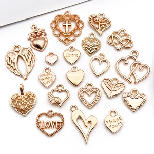 Close-up of rose gold hollow heart charms with Love and Thank You engravings