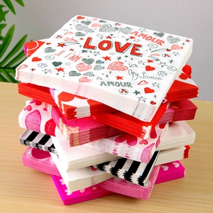 Valentine's Day paper napkins with heart patterns and Love and Amour typography