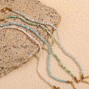 Macro shot of colorful natural stone beaded necklace with 18K gold plated lobster clasp