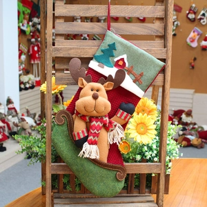 45cm Christmas stocking featuring plush elk on sleigh and festive tree on a wooden rack