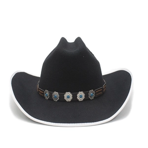 Close-up of black wool fedora featuring turquoise studs and vintage leather hat band