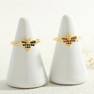 Detail of bee rings in 18k gold plated copper with colorful cubic zirconia inlays