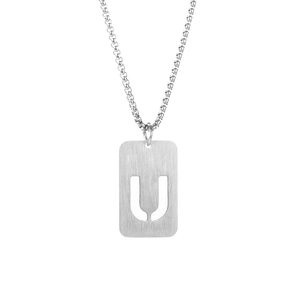 Detail shot of silver titanium steel necklace featuring a hollowed-out letter U pendant