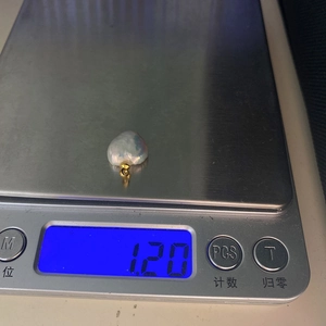 Digital scale showing a 1.20g white baroque freshwater pearl heart-shaped pendant