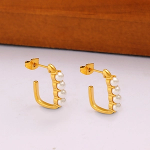 Elegant U-shaped gold stud earrings featuring four vertical white pearls in a minimalist design