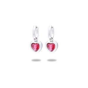 Macro shot of silver drop earrings featuring a faceted red heart-shaped gemstone