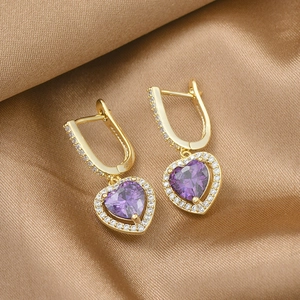 Elegant gold earrings with purple heart crystals and micro-pave cubic zirconia accents
