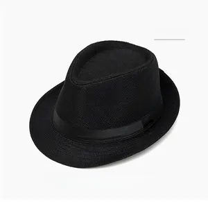 Detail of a black woven fedora hat featuring a matching satin ribbon and bow detail