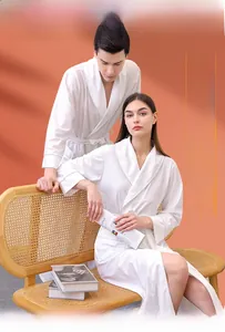 Detail of white waffle texture bathrobe featuring a stylish shawl collar on models