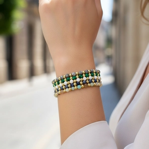 Bohemian multi-layer faceted Amazonite and gold bead bracelet set on female wrist